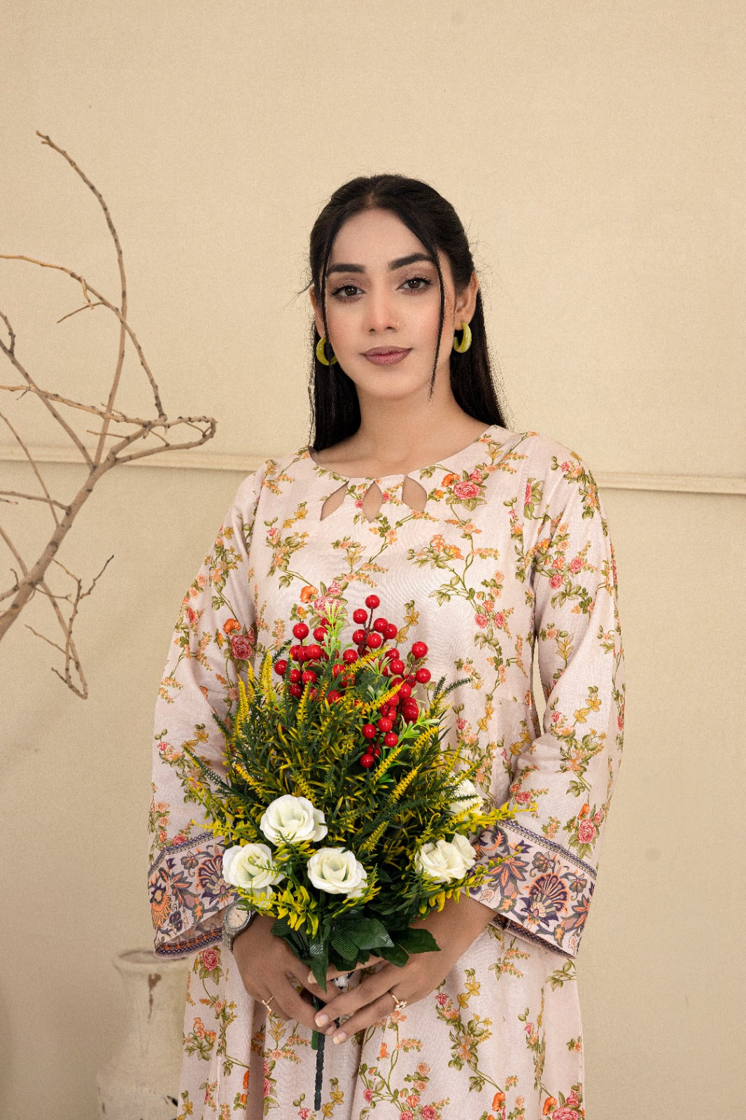 Floral printed cream cotton suit with a keyhole neckline complimented by straight leg pants