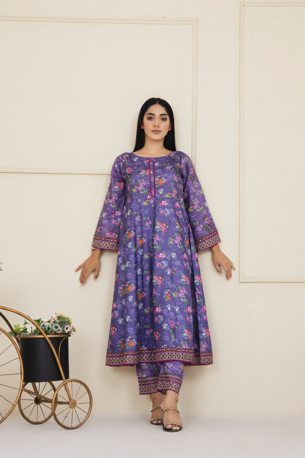 Floral printed dark purple cotton suit with an embroidered neckline complimented by straight leg pants