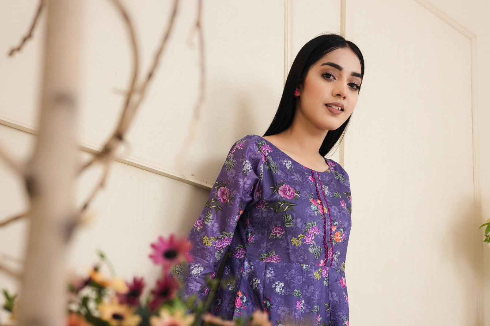 Floral printed dark purple cotton suit with an embroidered neckline complimented by straight leg pants